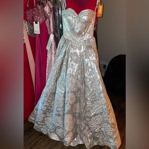 Gorgeous A-line Mac Duggal gown. Metallic silver with a soft pink floral design.